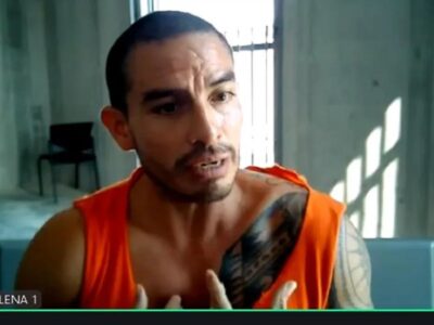 Daniel Salcedo interviene por videoconferencia con una camiseta naranja.